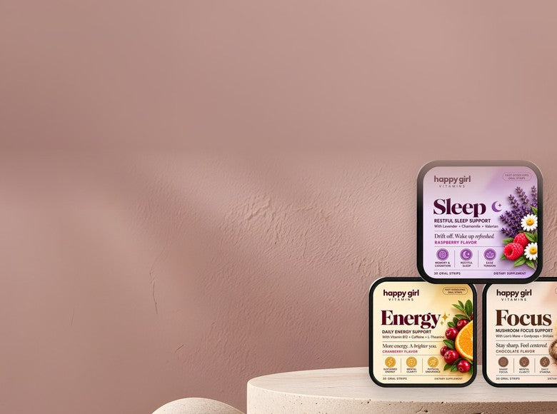 Sleep, Energy and Focus tins on a stone pedestal
